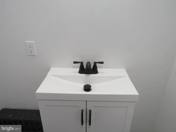 a close view of sink cabinets and roof