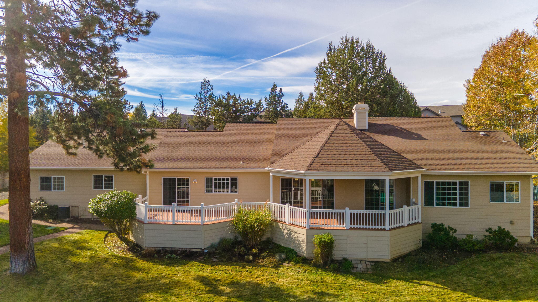 61504 Southeast Hill Ridge Road Bend, OR 97702 - Photo 57 of 70 a front view of house with yard and swimming pool