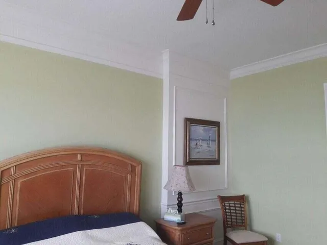 a bedroom with a bed and a dresser