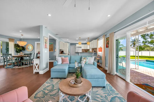 a living room with furniture or couch and a wooden floor