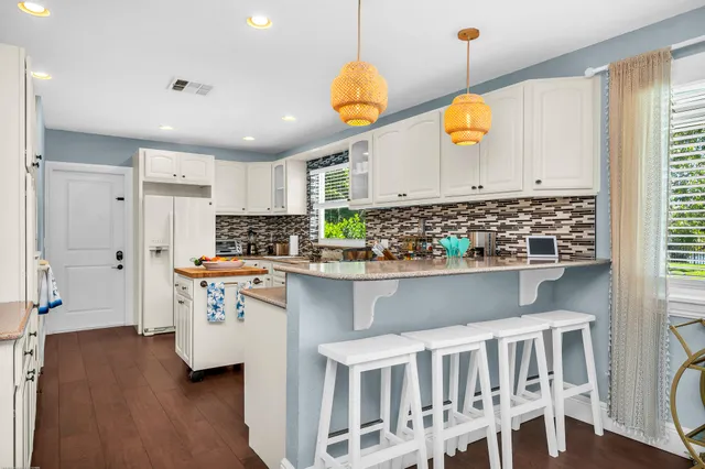 a kitchen with a sink and a window