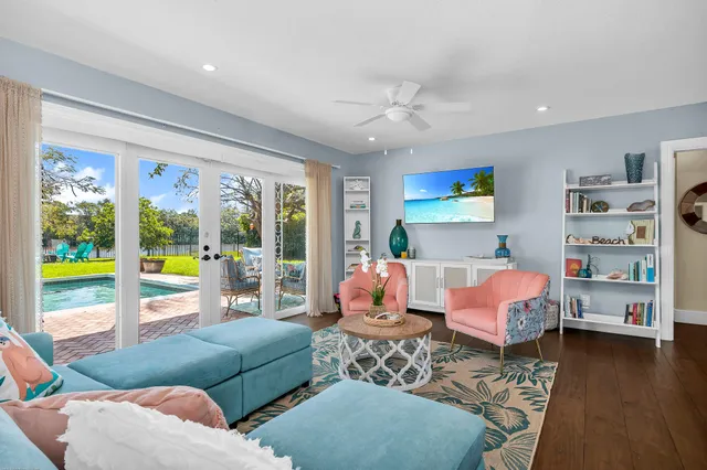 a living room with furniture and a flat screen tv