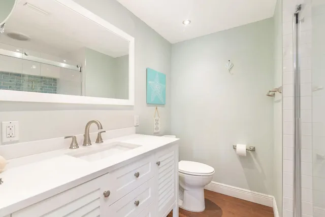 a room with a wooden floor and a book shelf
