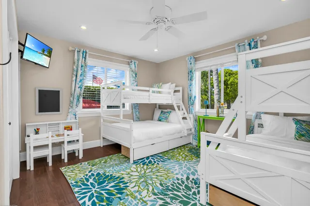a view of dining room with wooden floor and a table