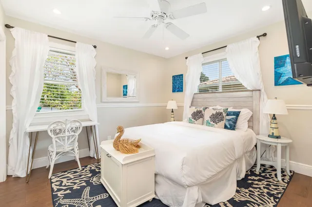 a bedroom with a bed and a book shelf