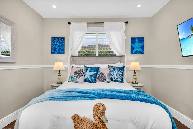 a bathroom with a double vanity sink toilet and shower