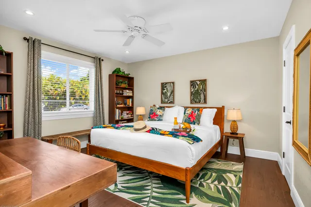 a backyard of a house with lots of green space and outdoor seating