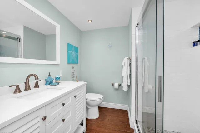 a view of a garden with tall trees