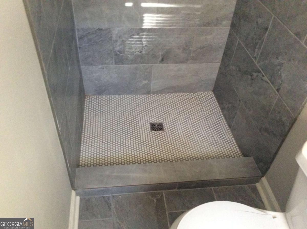 209 Decatur Road McDonough, GA 30253 - Photo 24 of 33 a bathroom with a toilet