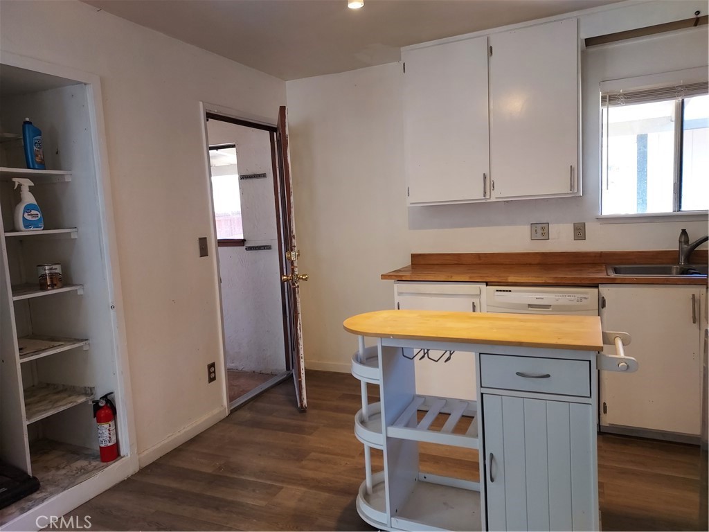 6135 Ridgeview Drive Clearlake, CA 95422 - Photo 17 of 36 a room that has a sink and a stove in it