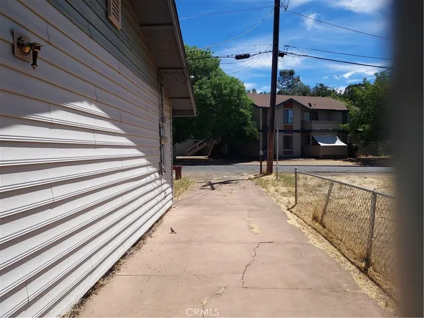 a view of a house with a tree