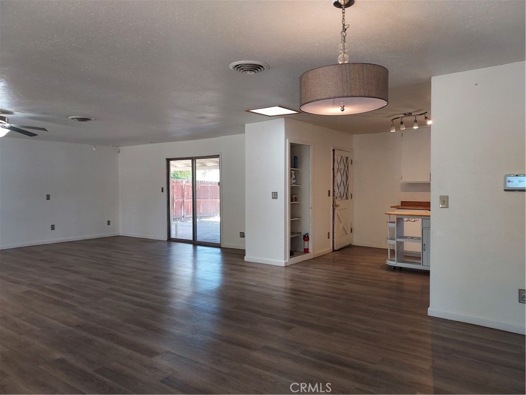 6135 Ridgeview Drive Clearlake, CA 95422 - Photo 10 of 36 a view of an empty room with window and wooden floor