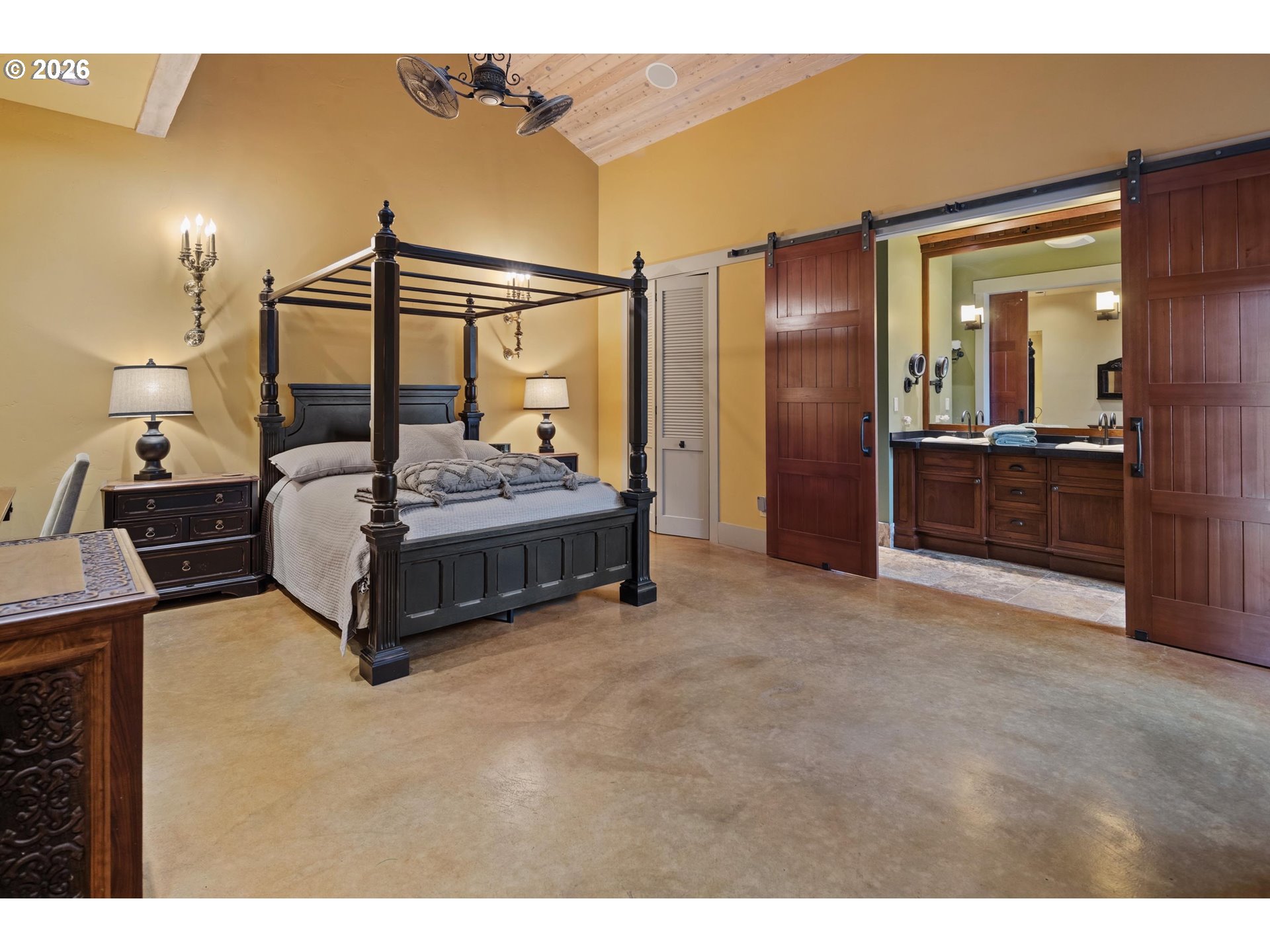 545 McAdams Road East Longview, WA 98632 - Photo 22 of 46 a spacious bedroom with a bed and wooden floor