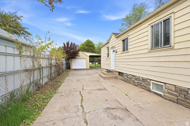 676 South 500 West Provo, UT 84601 - Photo 29 of 29 View of side of property with a garage, an outbuilding, and driveway