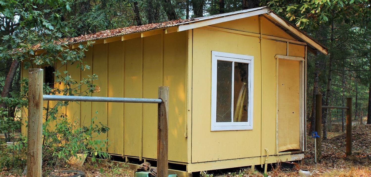3615 Dick George Road Cave Junction, OR 97523 - Photo 20 of 24 Storage shed with hitching post on eithe