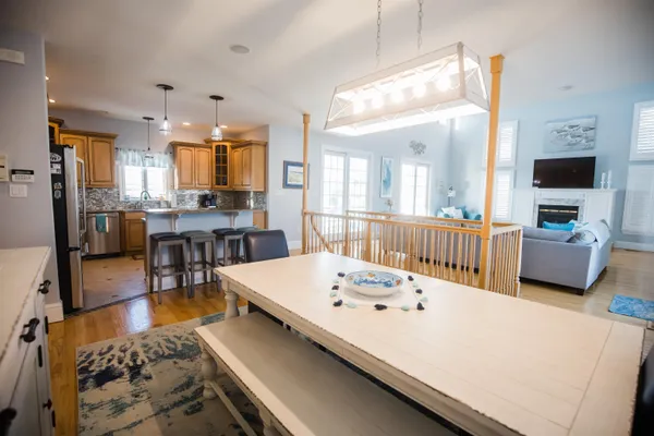 a large kitchen with a table and chairs