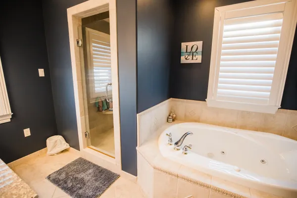 a bathroom with a bathtub and a sink