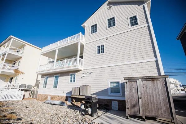 a view of a house with wooden deck