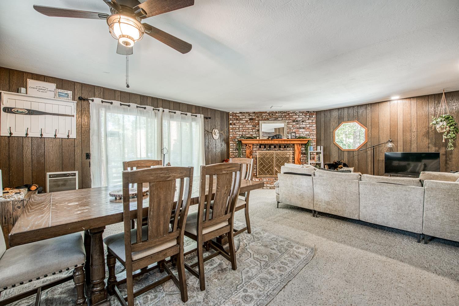 42488 Rock Ledge Road Shaver Lake, CA 93664 - Photo 13 of 37 a view of a dining room with furniture window and wooden floor