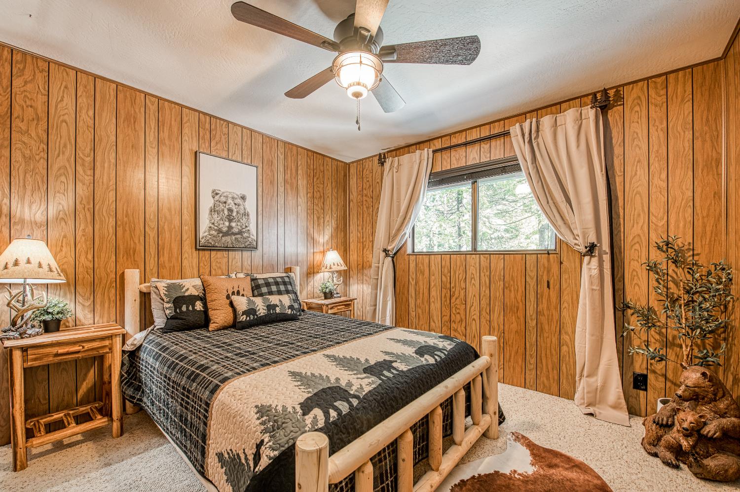 42488 Rock Ledge Road Shaver Lake, CA 93664 - Photo 22 of 37 a bedroom with a bed and a window