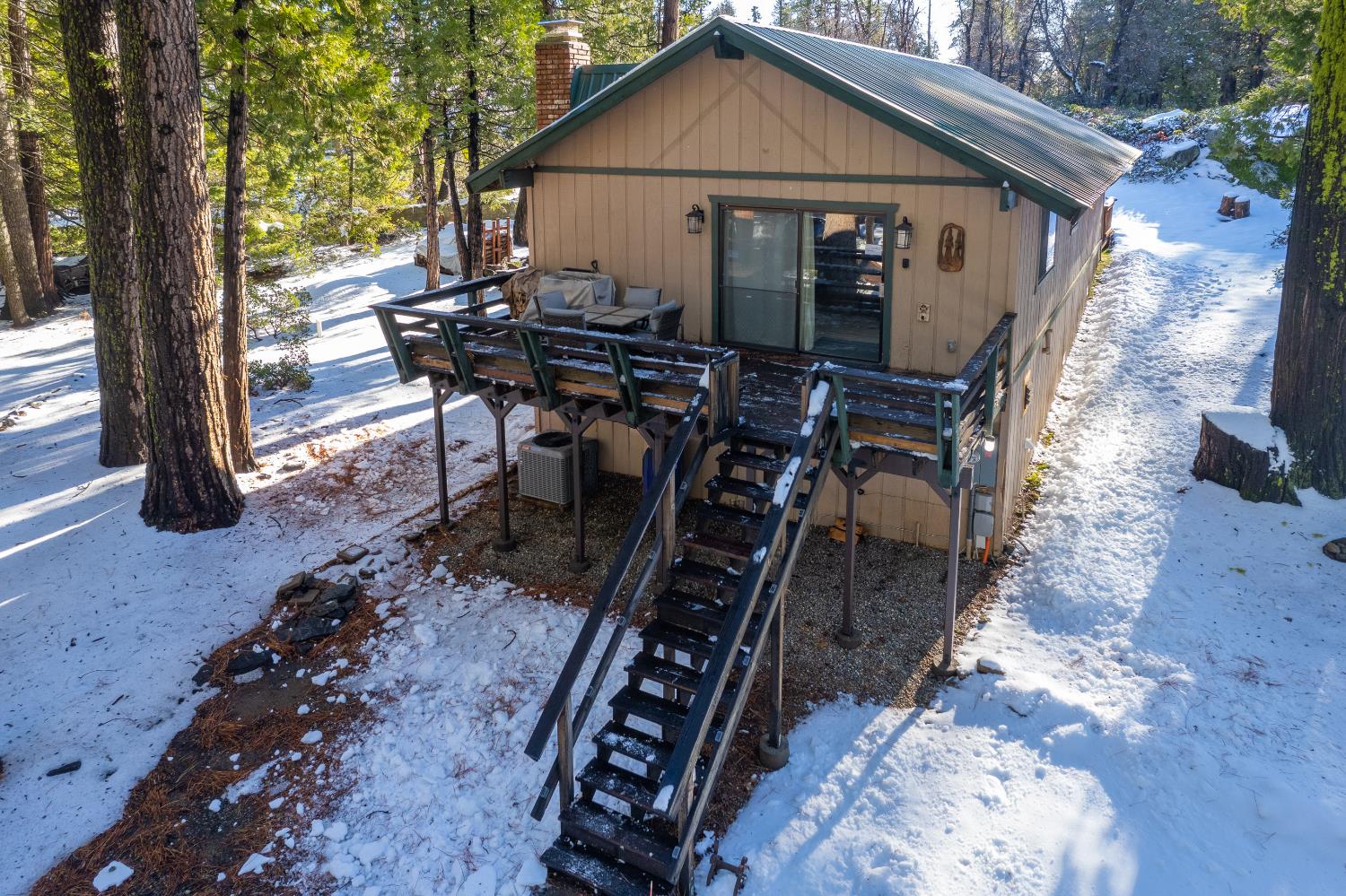 42488 Rock Ledge Road Shaver Lake, CA 93664 - Photo 30 of 37 a view of a house with backyard and sitting area