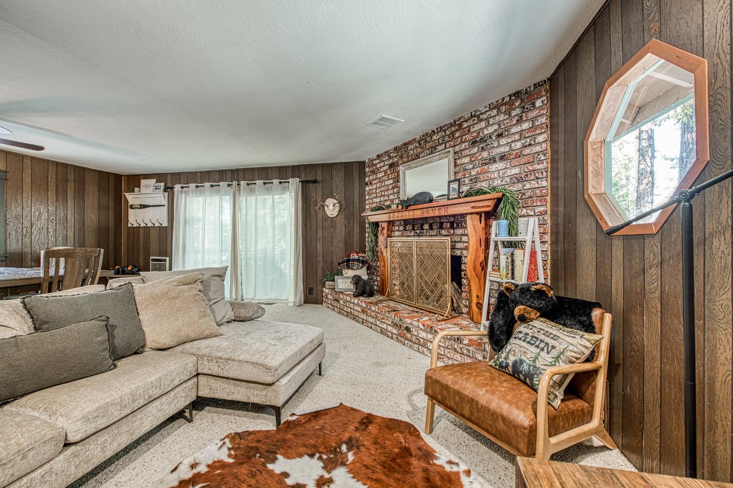 42488 Rock Ledge Road Shaver Lake, CA 93664 - Photo 6 of 37 a living room with furniture and a fireplace