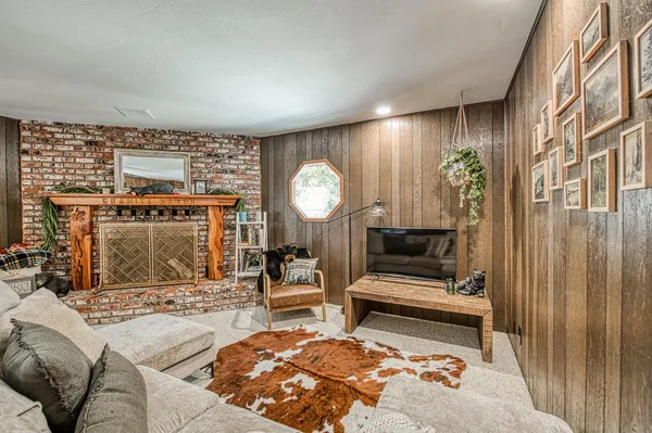 a living room with a couch and a fireplace