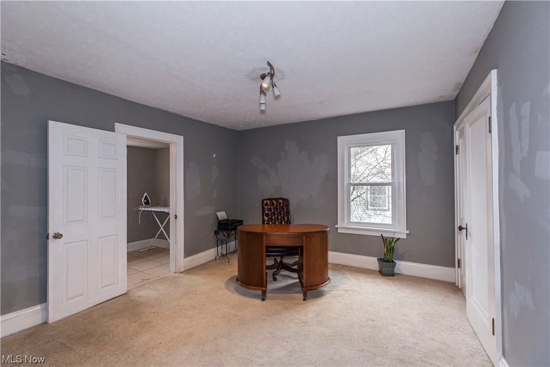 646 Copley Road Akron, OH 44320 - Photo 24 of 32 Carpeted office with a textured ceiling