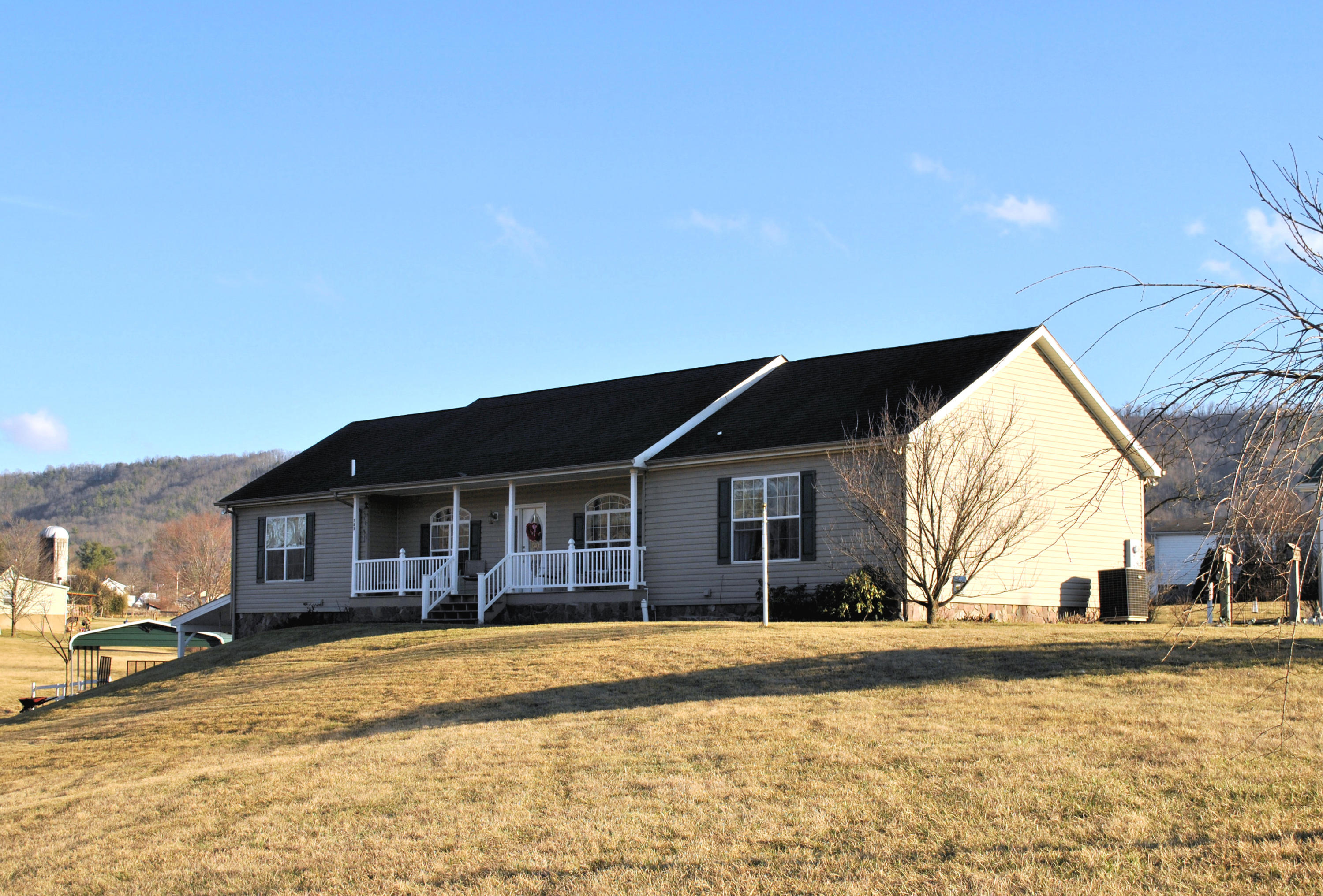 785 Union Valley Road Riner, VA 24149 - Photo 1 of 86 a front view of a house with a yard
