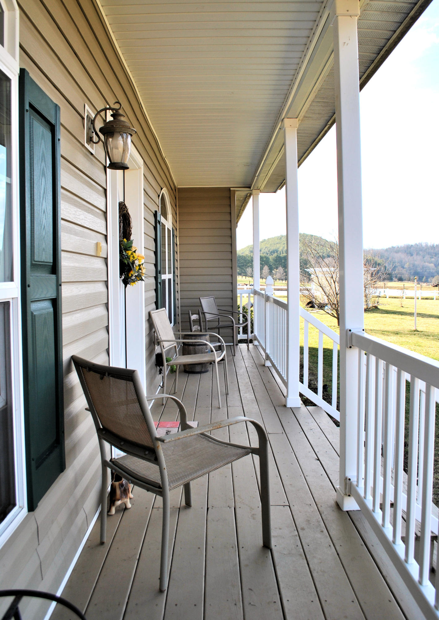 785 Union Valley Road Riner, VA 24149 - Photo 20 of 86 a view of a balcony with furniture and floor to ceiling window