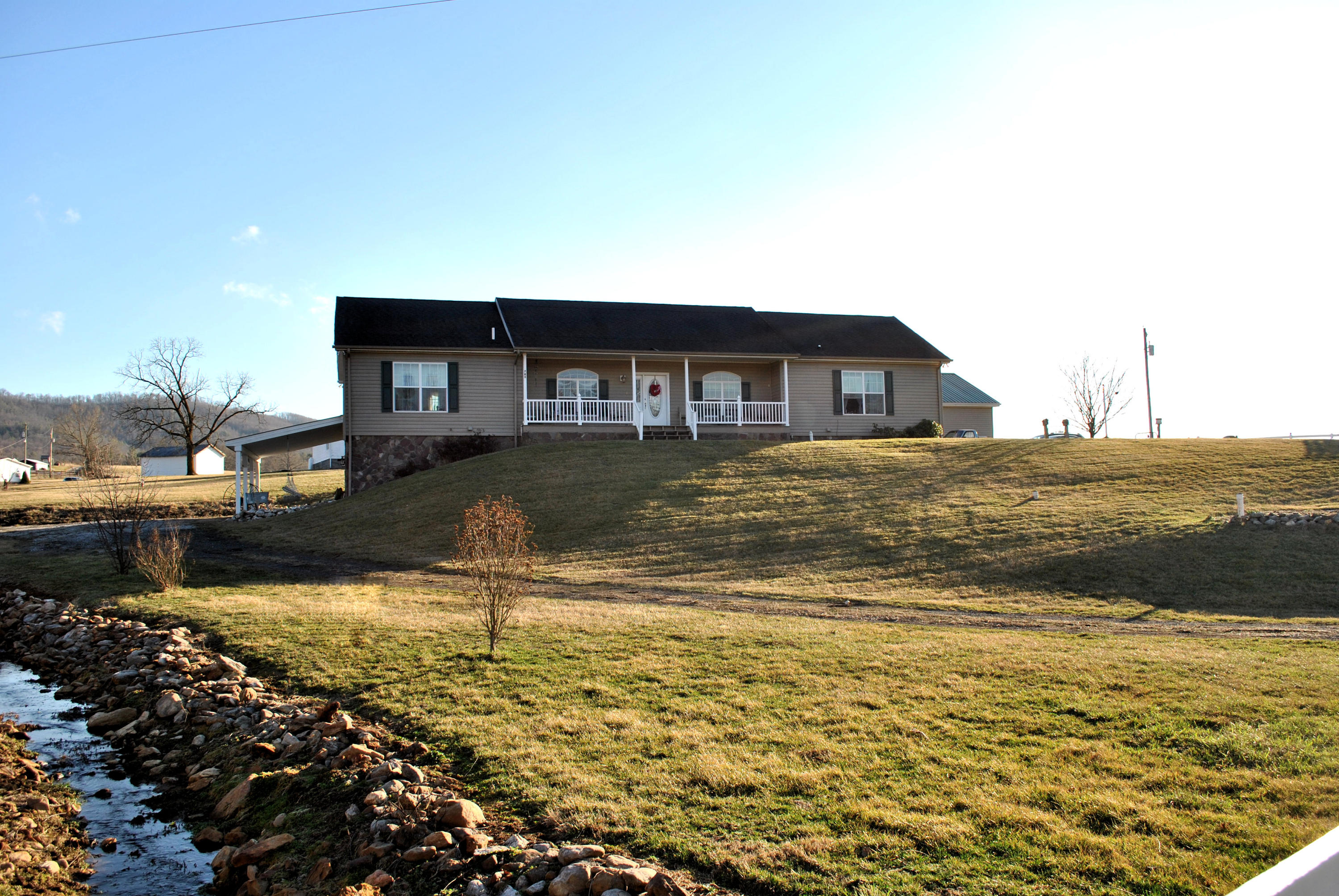 785 Union Valley Road Riner, VA 24149 - Photo 3 of 86 a view of a lake with a house