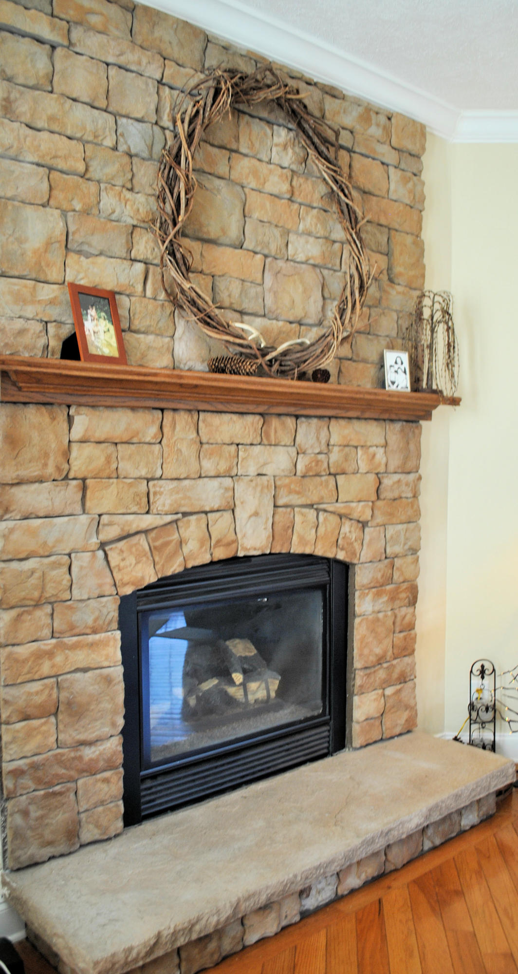 785 Union Valley Road Riner, VA 24149 - Photo 24 of 86 a fireplace with a clock on wall
