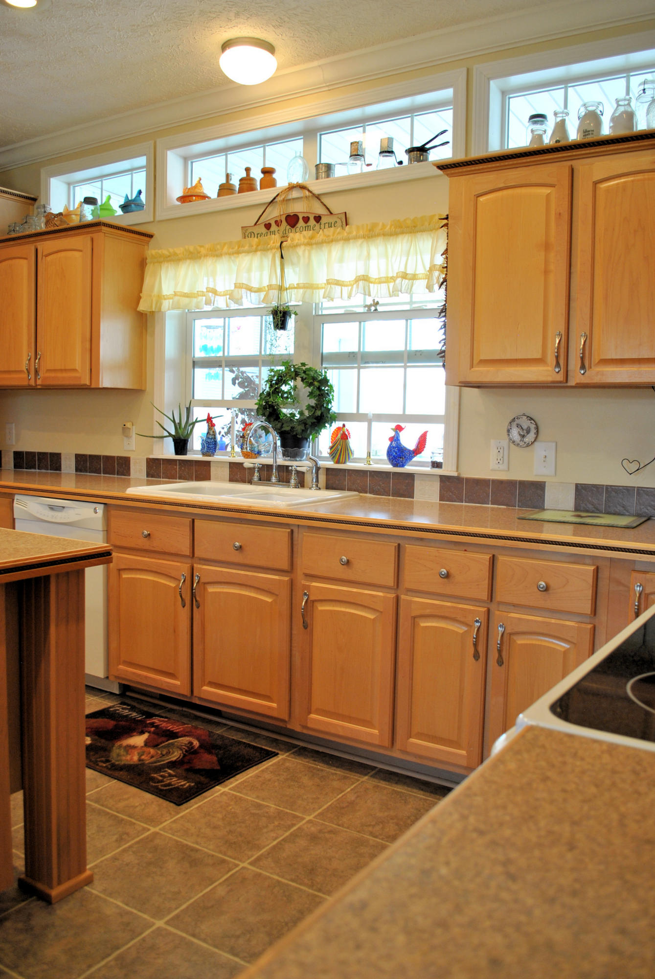 785 Union Valley Road Riner, VA 24149 - Photo 31 of 86 a kitchen with stainless steel appliances granite countertop a sink stove and cabinets