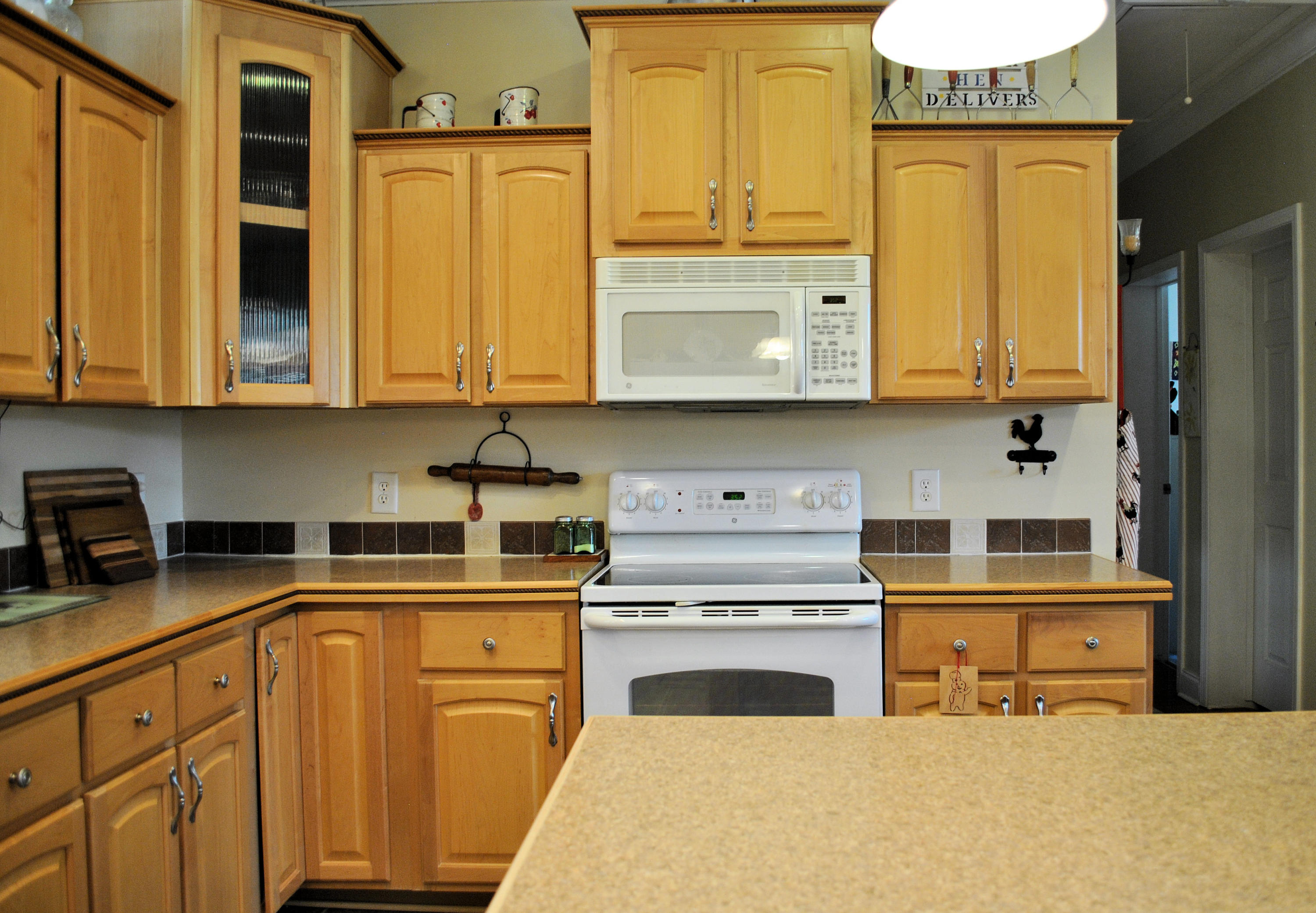 785 Union Valley Road Riner, VA 24149 - Photo 34 of 86 a kitchen with stainless steel appliances granite countertop a sink a stove and cabinets