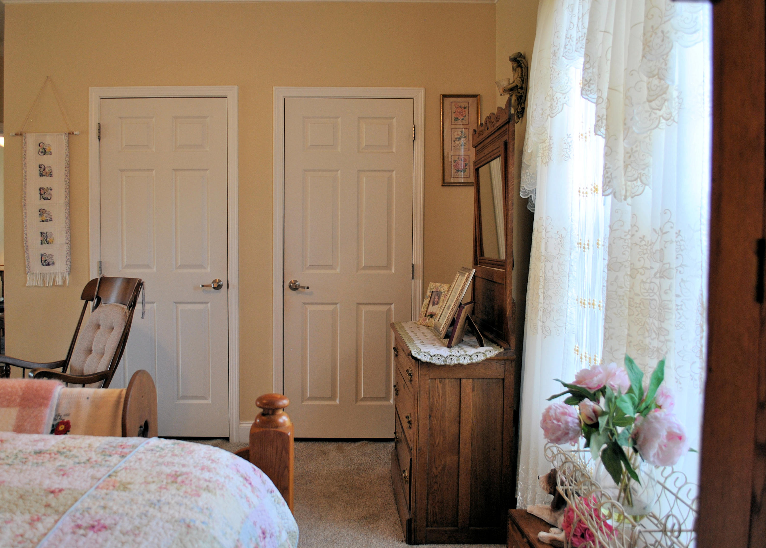 785 Union Valley Road Riner, VA 24149 - Photo 40 of 86 a bedroom with a bed a flat screen tv and a potted plant