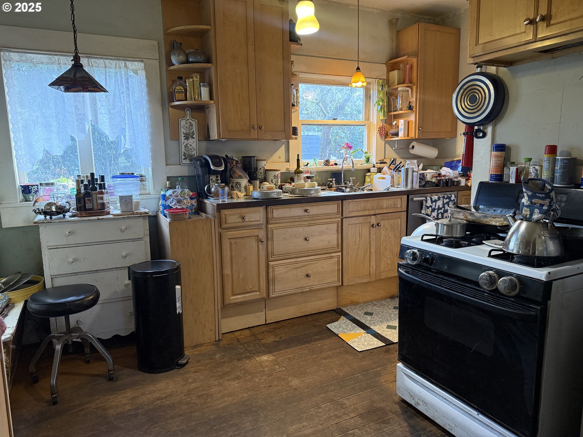 5908 Southwest 45th Avenue Portland, OR 97221 - Photo 2 of 4 a kitchen with a stove and cabinets