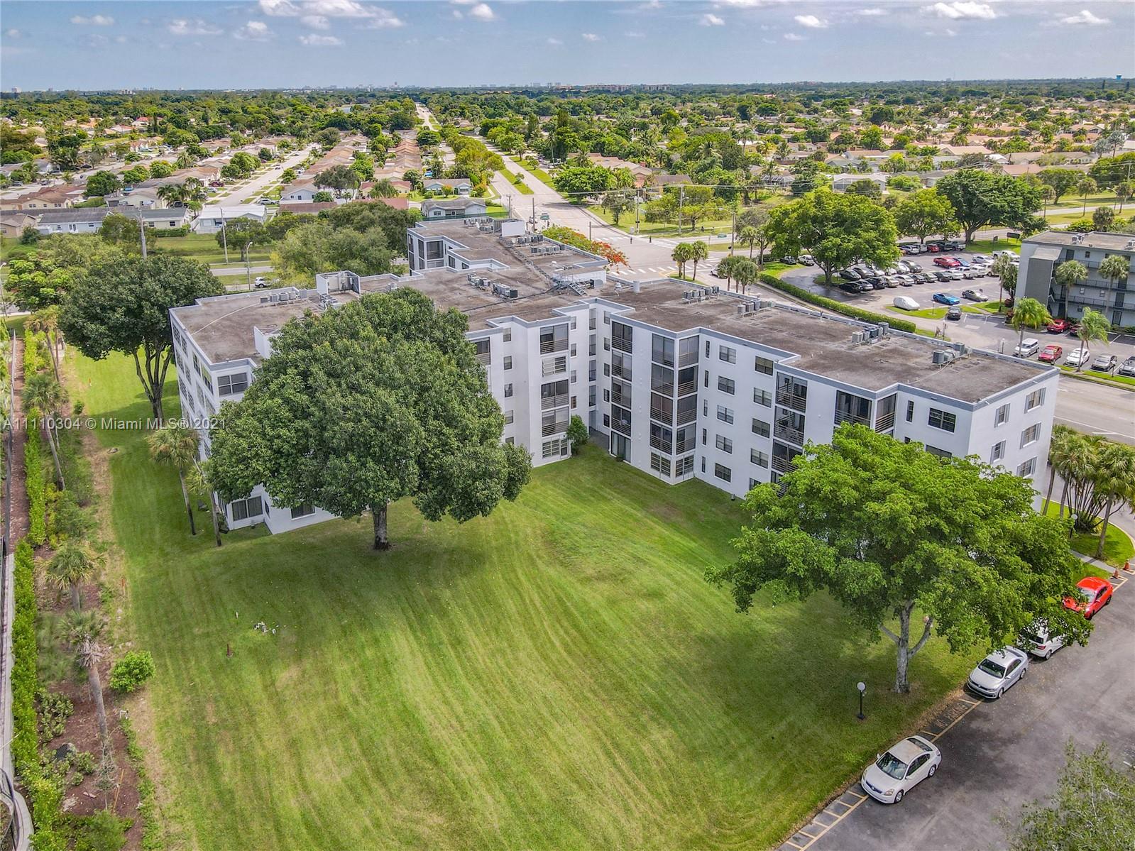 9235 Southwest 8th Street, Unit 401 Boca Raton, FL 33428 - Photo 1 of 40 a view of a city with tall buildings