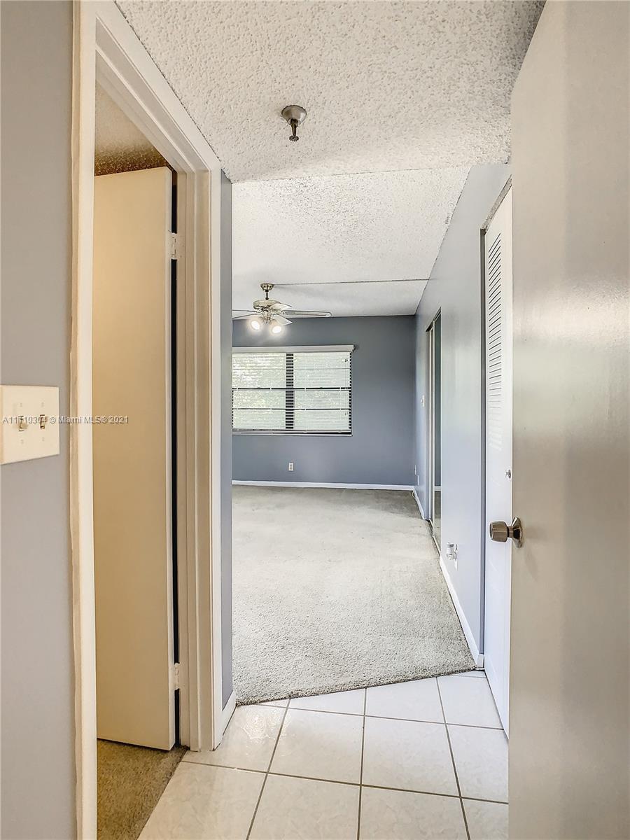 9235 Southwest 8th Street, Unit 401 Boca Raton, FL 33428 - Photo 21 of 40 a view of a hallway