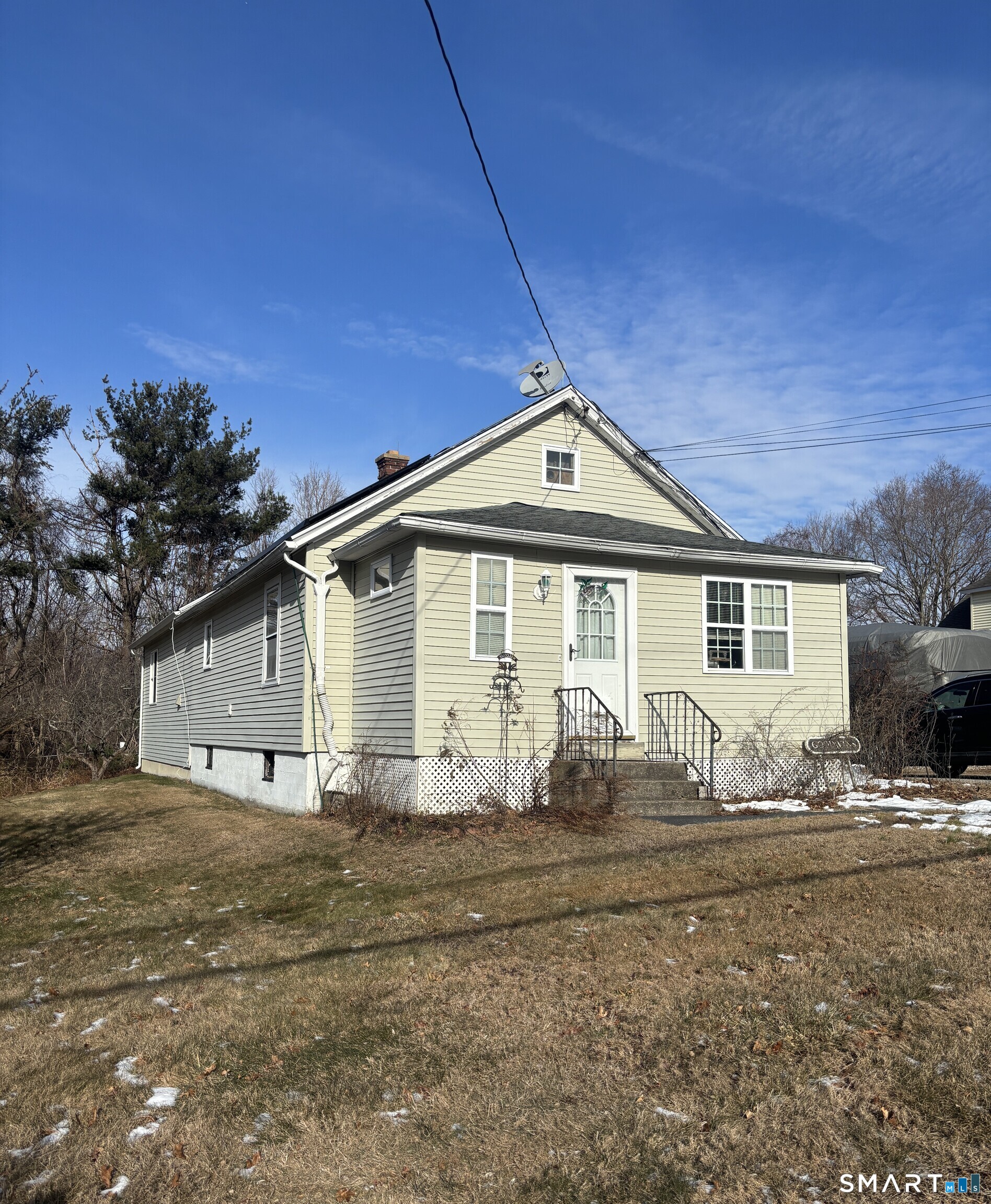 147 Halls Hill Road Colchester, CT 06415 - Photo 1 of 40 a front view of a house with large windows
