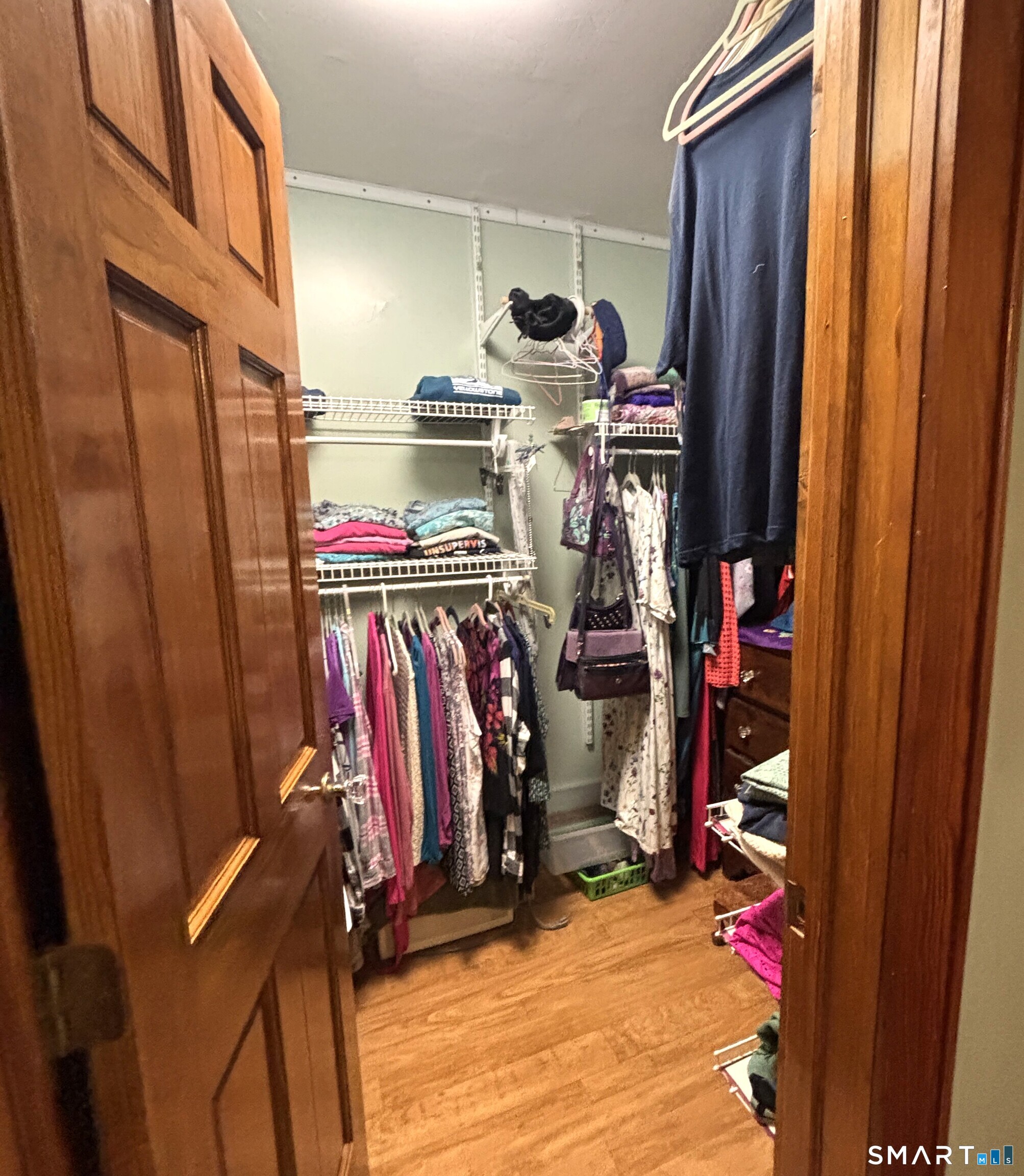 147 Halls Hill Road Colchester, CT 06415 - Photo 17 of 40 a view of walk in closet with clothes and shoes