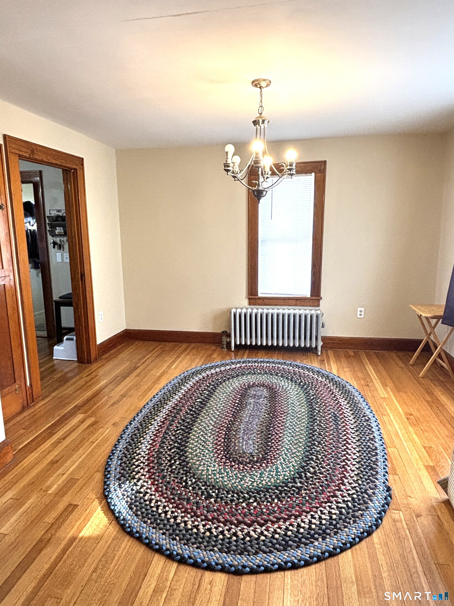 147 Halls Hill Road Colchester, CT 06415 - Photo 26 of 40 a view of a room with wooden floor windows and fireplace
