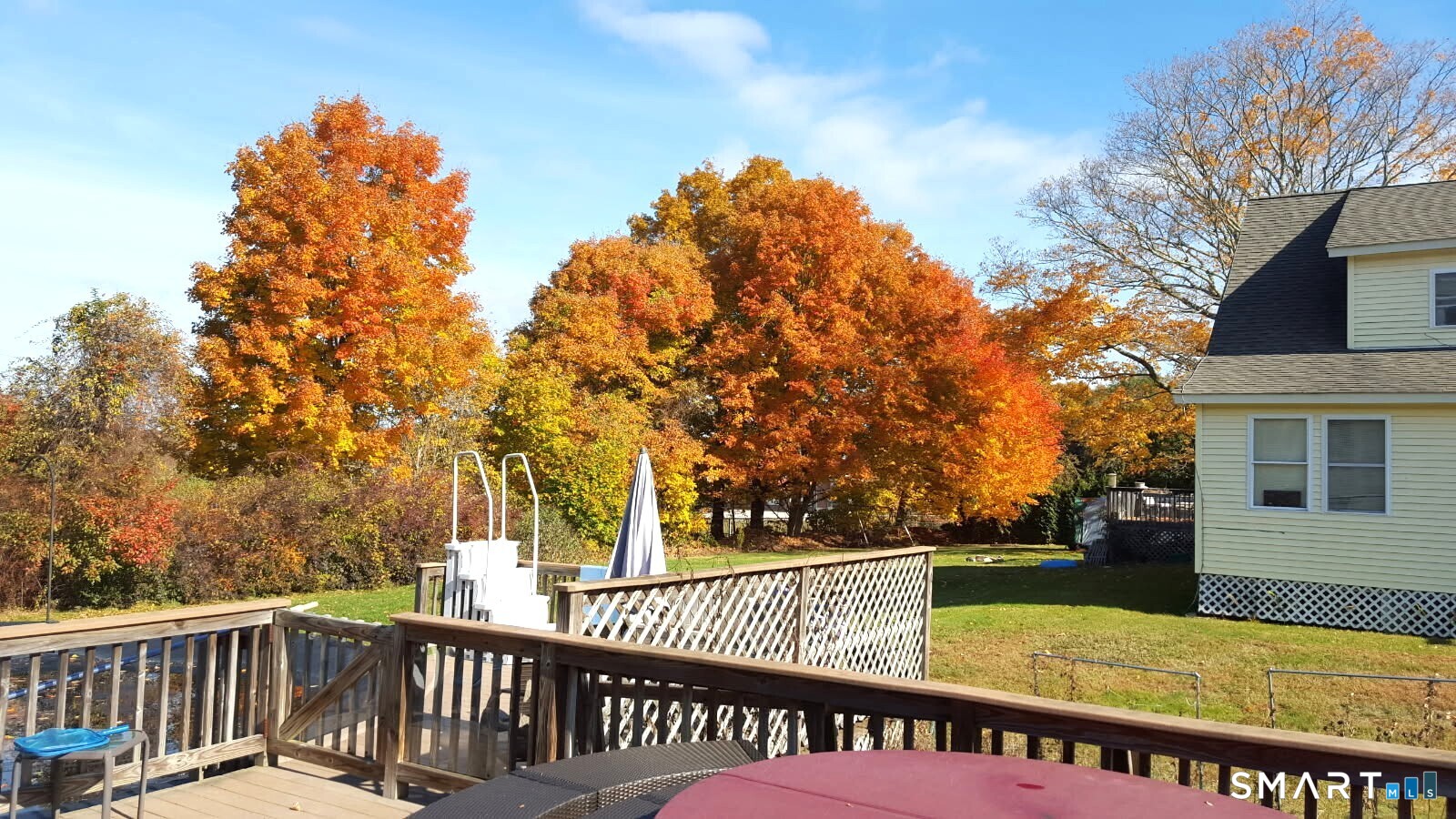 147 Halls Hill Road Colchester, CT 06415 - Photo 3 of 40 a view of a roof deck with wooden fence and floor