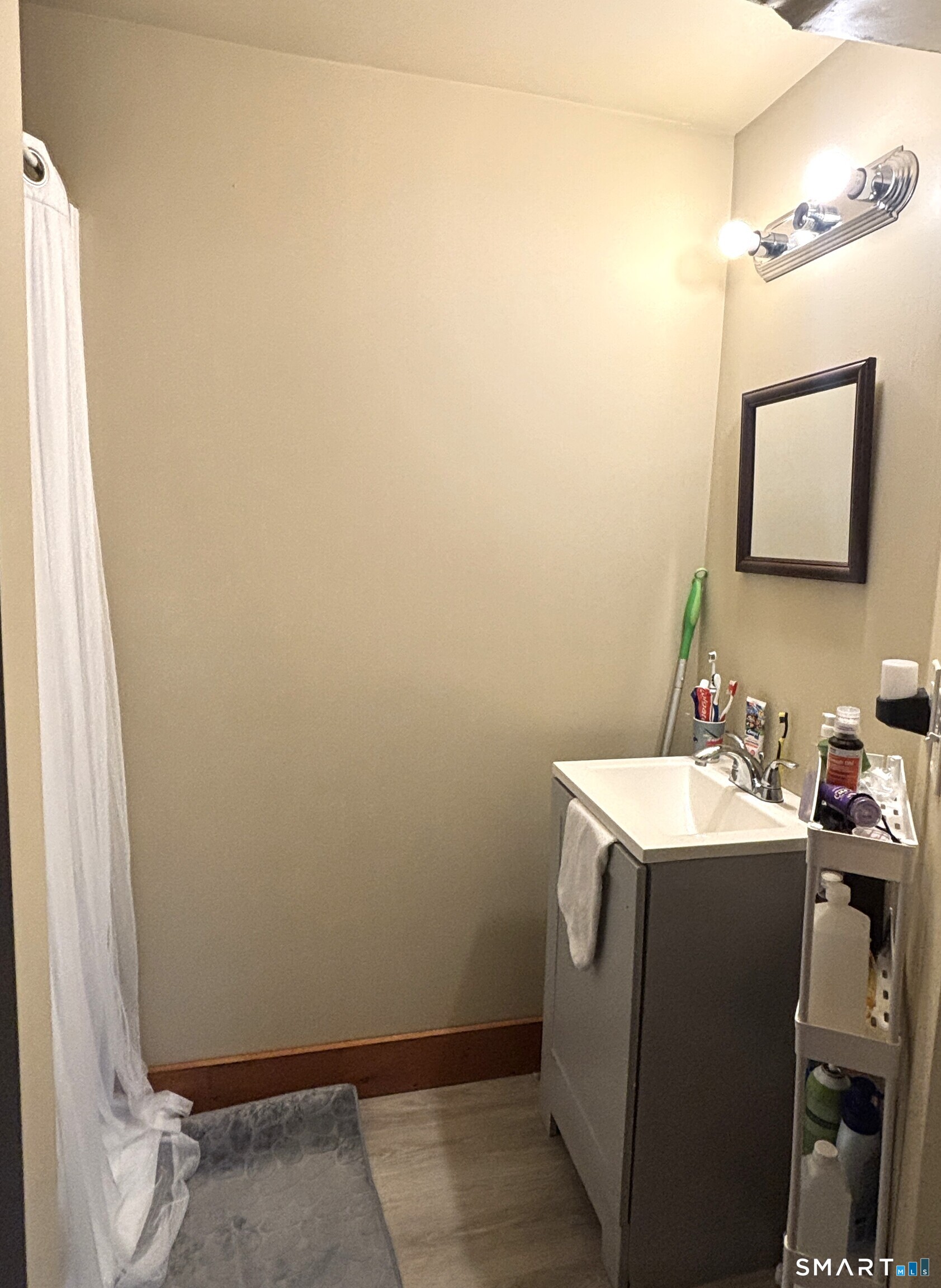 147 Halls Hill Road Colchester, CT 06415 - Photo 34 of 40 a bathroom with a sink toilet and vanity