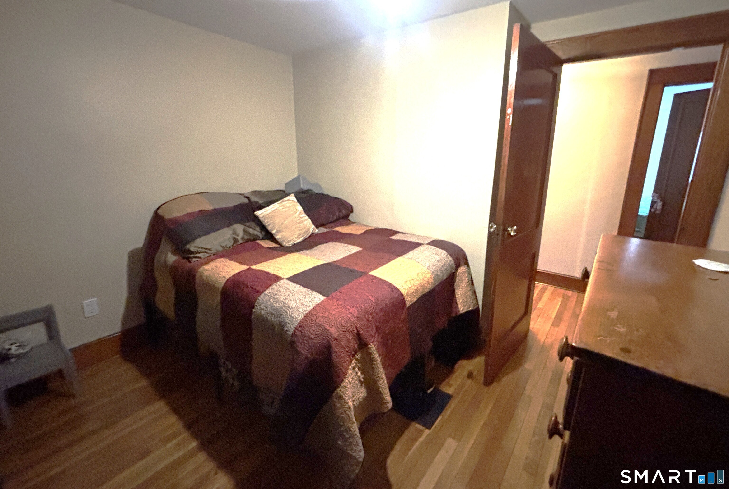 147 Halls Hill Road Colchester, CT 06415 - Photo 38 of 40 a bed sitting in a bedroom next to a window