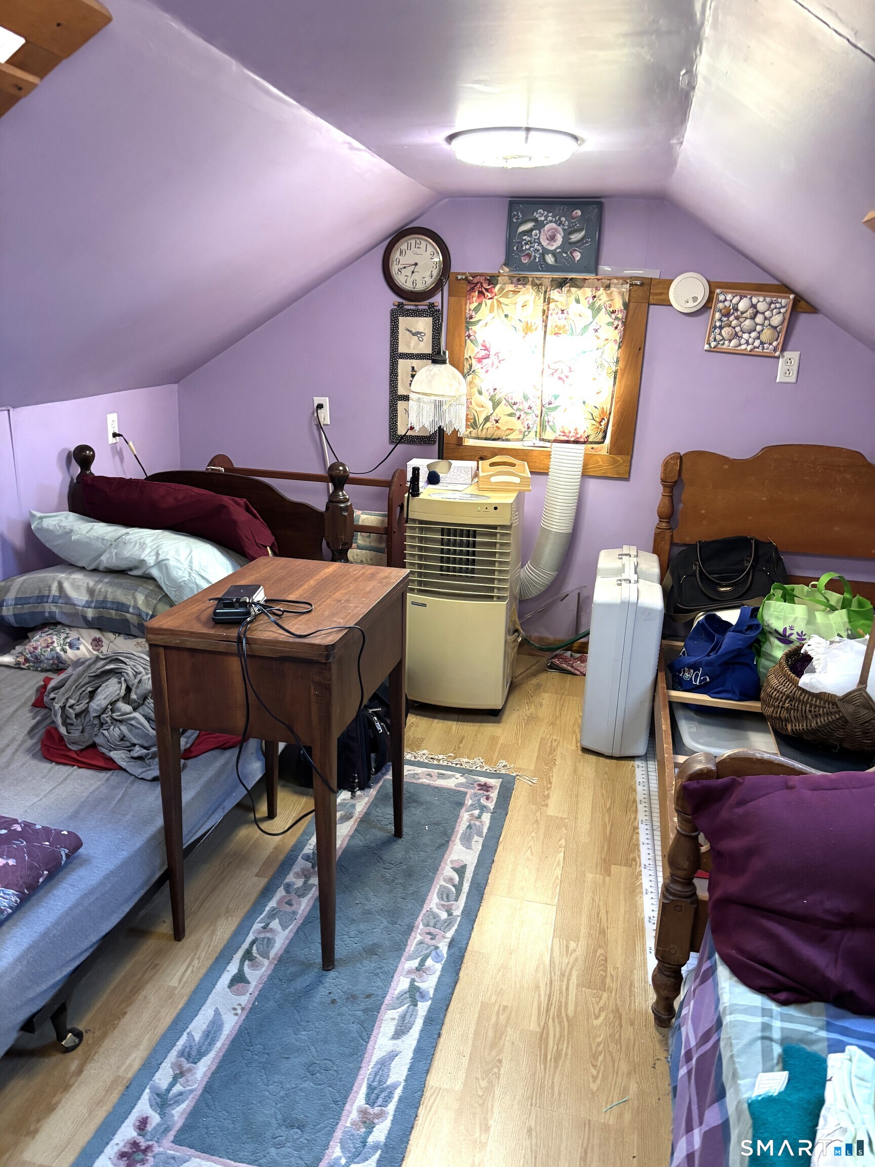 147 Halls Hill Road Colchester, CT 06415 - Photo 9 of 40 a bedroom with furniture and a wooden floor