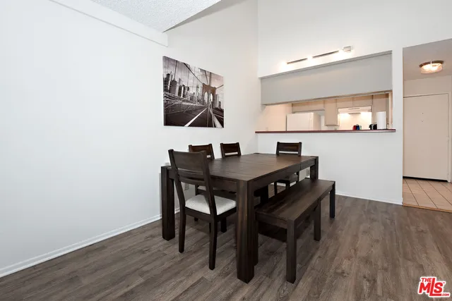 a view of a workspace with furniture and wooden floor