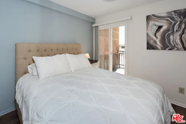 a large white bed in a white room