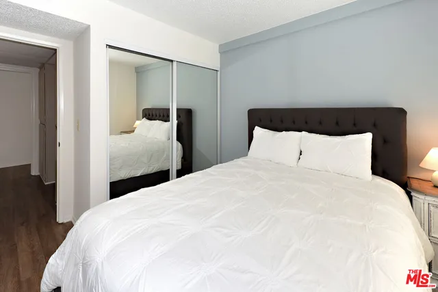 a large white bed in a white room