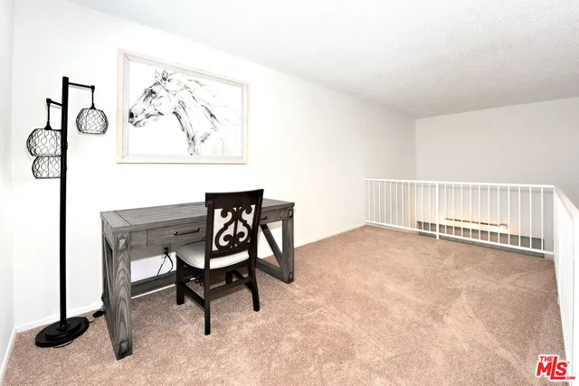 a workspace with furniture and a window