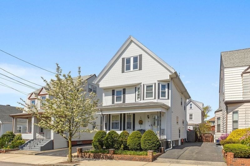 18 Baker Road Everett, MA 02149 - Photo 1 of 31 a front view of a house with a yard